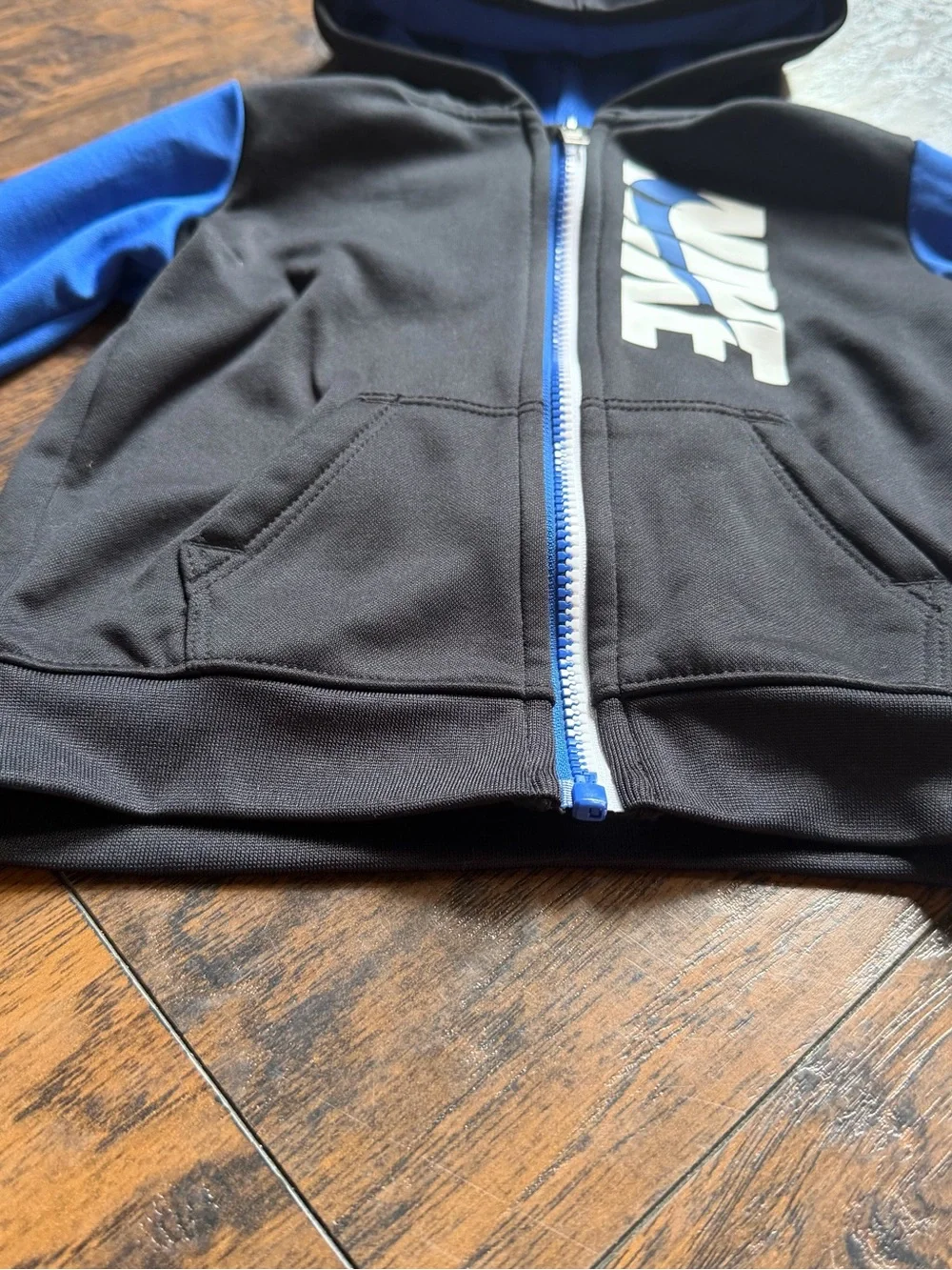 Nike Black Hoodie with Blue Sleeves and White Logo